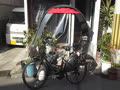 自転車の雨除け日よけ、傘、ポンチョ、合羽、レインコート？
